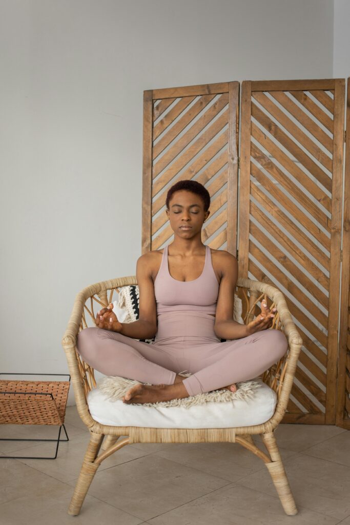 Woman closes eyes in meditation position.