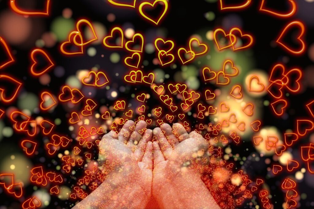 Hearts surrounding palms of hands.